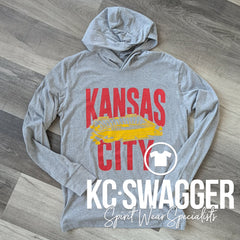 STADIUM LONG SLEEVE HOODED TEE KCSWAG